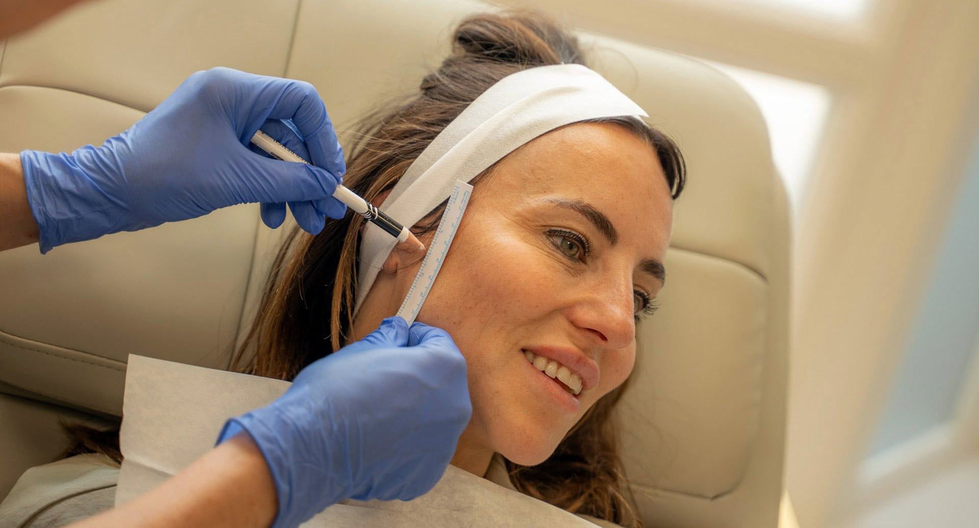 A patient being prepped for dermal filler injections