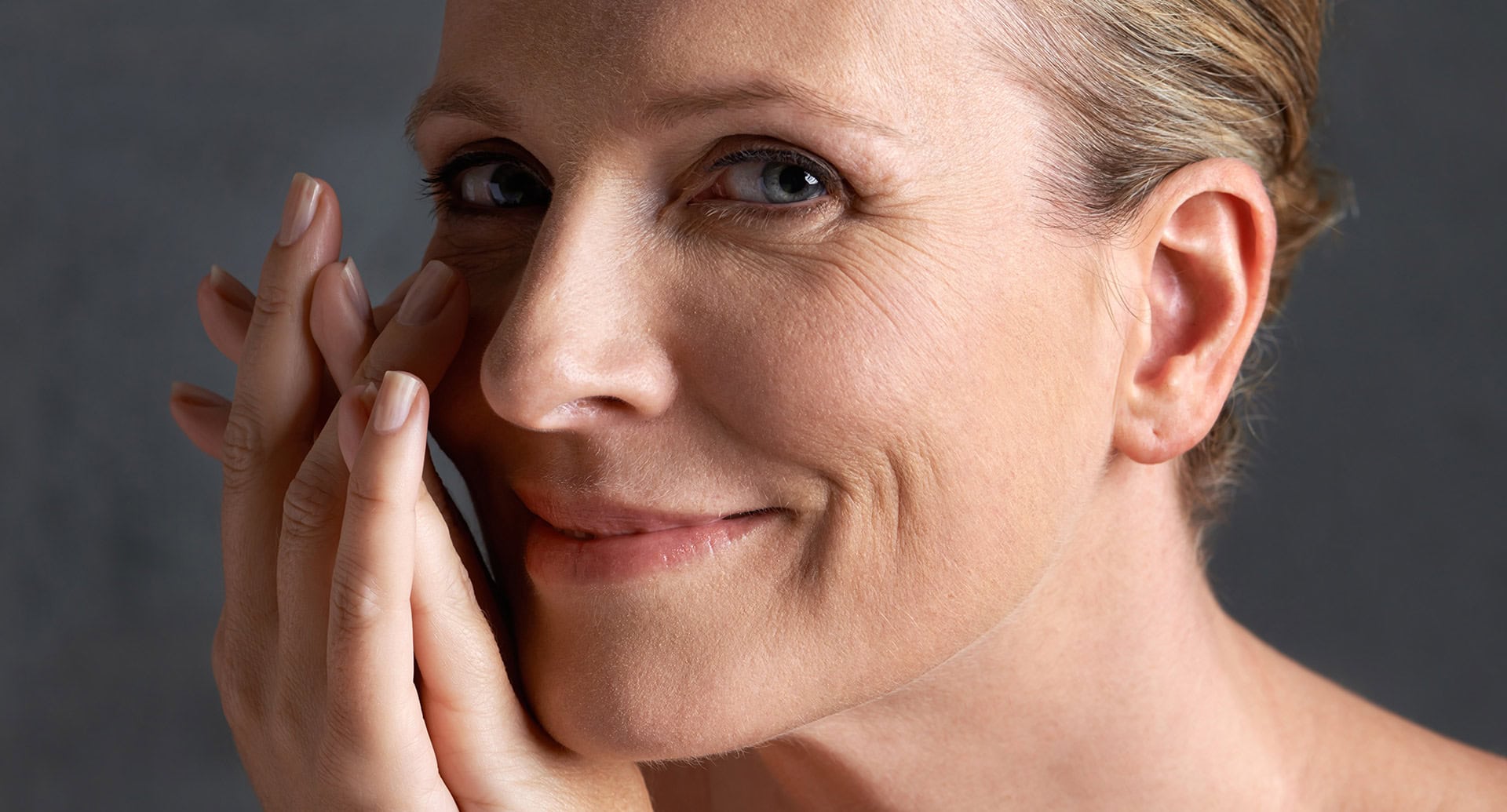 A image of a smiling mature lady to illustrate ageing cheek definition treatment in Morpeth